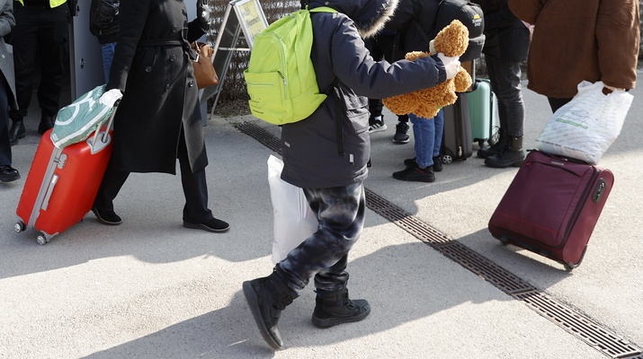 Flüchtlinge mit Koffern
