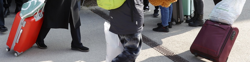 Flüchtlinge mit Koffern