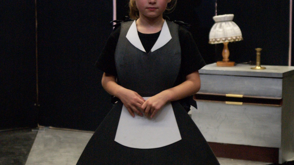 Ein Kind in Kostüm im Kindertheater Wien.
