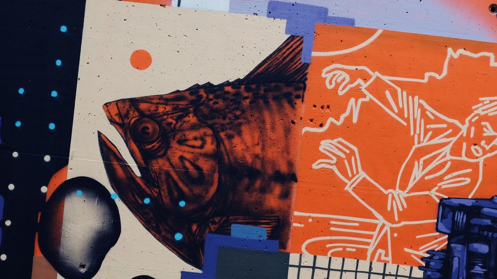 Graffiti mit Fisch und Mensch