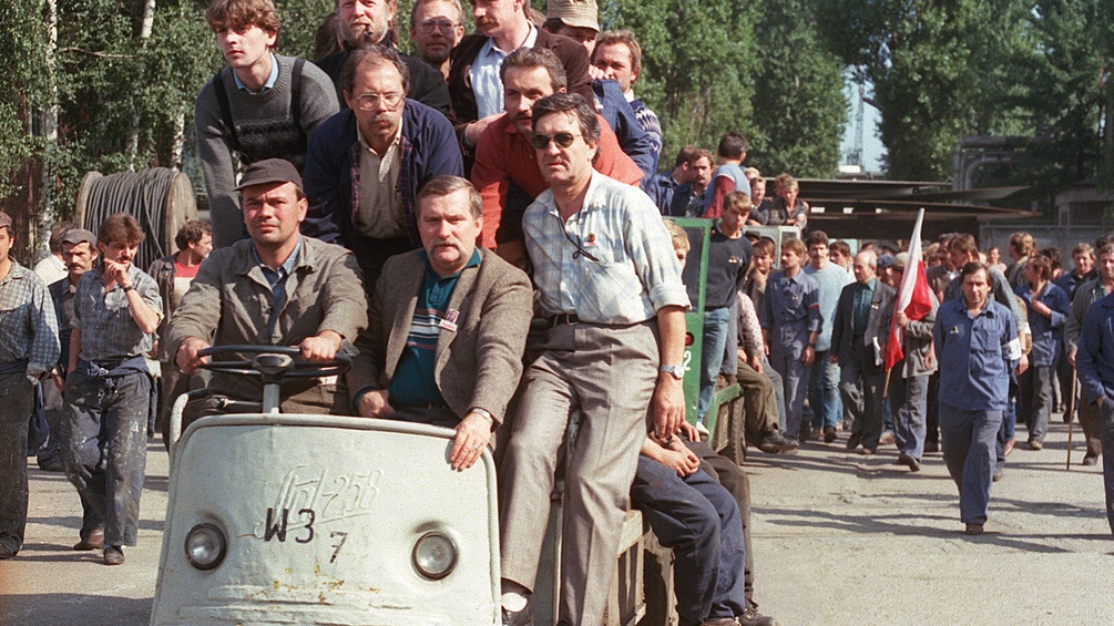Polnische Männer auf einem Wagen.