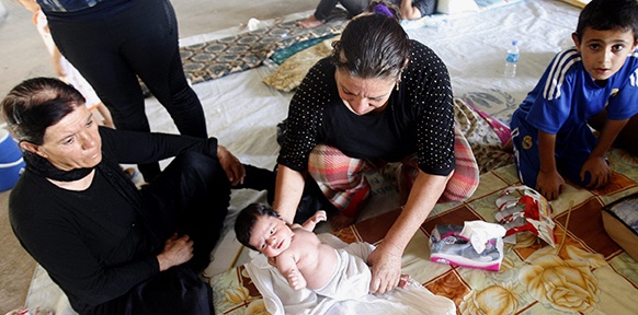 Christenfamilie in einem Lager in Erbil